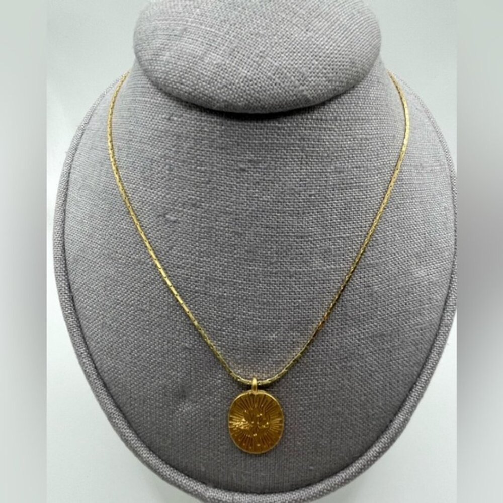 #005 Vintage gold tone necklace with etched flower detailing oval shape pendant
